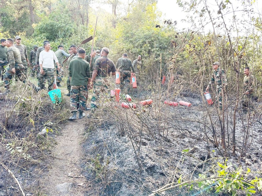 Assam Rifles personnel at the site of fire incident in Kohima.